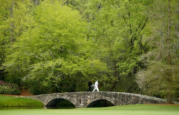 Tiger Woods (L) of the U.S. walks over the Nelson Bridge 02.jpg